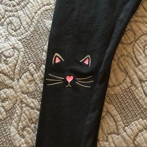 Black justice leggings with cute cat face on knee
